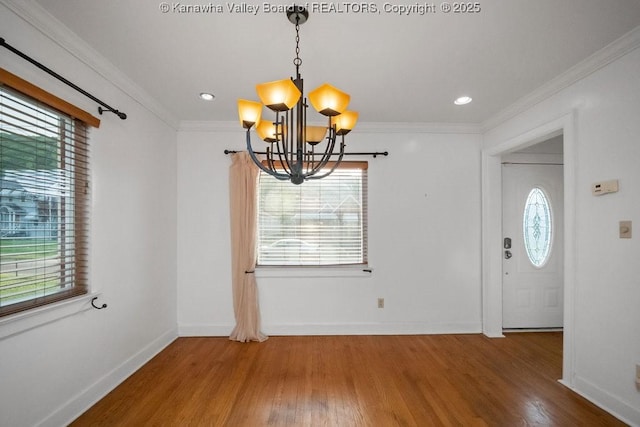 unfurnished dining area featuring a notable chandelier and a healthy amount of sunlight
