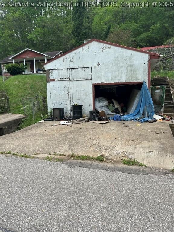 view of outbuilding featuring cooling unit and an outbuilding