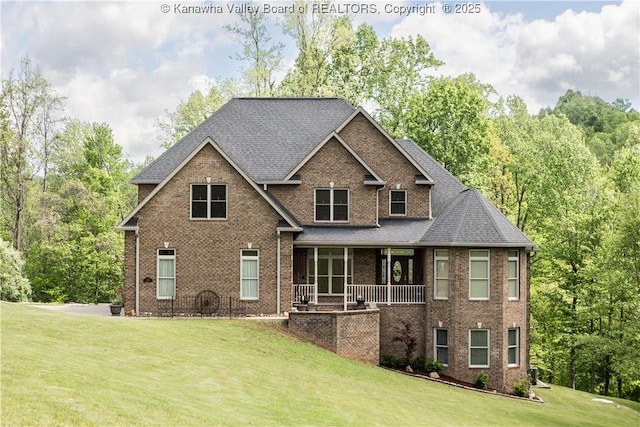 2804 Hash Ridge Rd, Barboursville, WV 25504 - exterior space featuring brick siding, a shingled roof, a front lawn, and covered porch