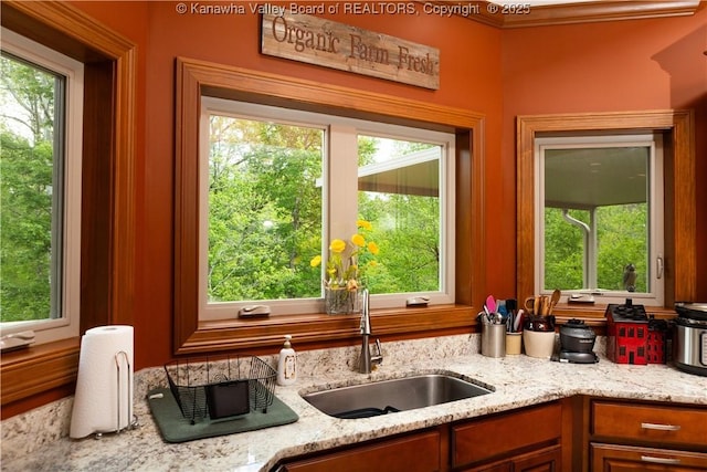 2804 Hash Ridge Rd, Barboursville, WV 25504 - kitchen featuring light stone countertops, a healthy amount of sunlight, and a sink