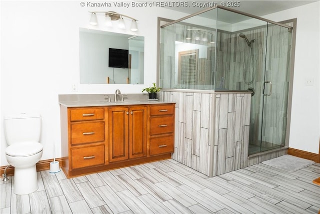 2804 Hash Ridge Rd, Barboursville, WV 25504 - bathroom with vanity, a shower stall, toilet, and wood finish floors