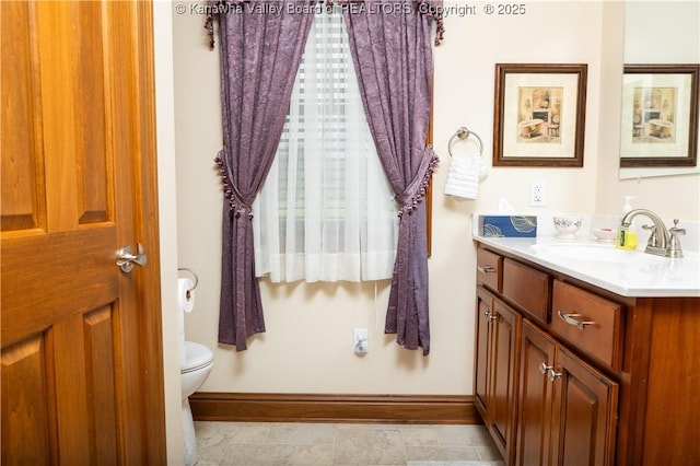 2804 Hash Ridge Rd, Barboursville, WV 25504 - bathroom with baseboards, toilet, and vanity