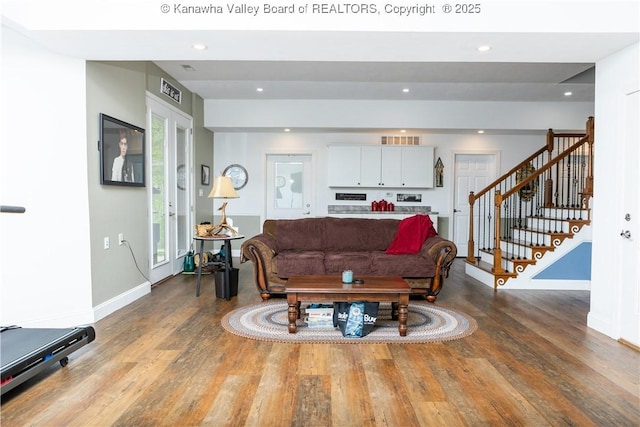 2804 Hash Ridge Rd, Barboursville, WV 25504 - living area featuring baseboards, wood finished floors, visible vents, and stairway