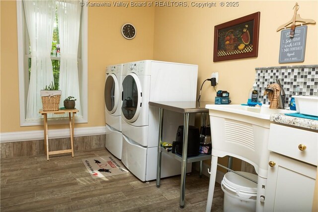 2804 Hash Ridge Rd, Barboursville, WV 25504 - washroom with laundry area, washer and clothes dryer, and wood finished floors