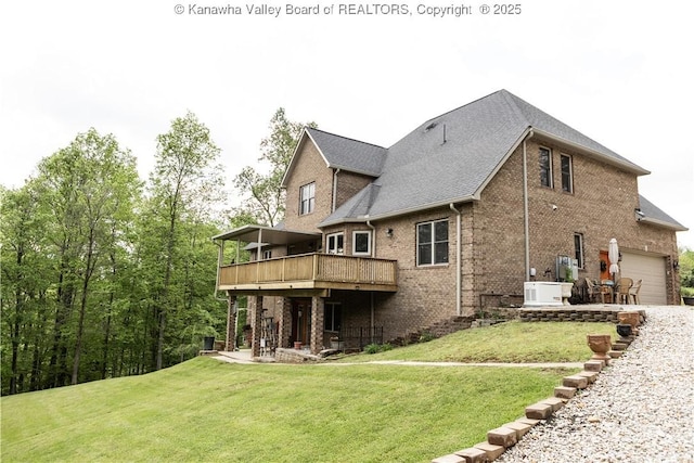 2804 Hash Ridge Rd, Barboursville, WV 25504 - rear view of house featuring a lawn, brick siding, a deck, and a garage