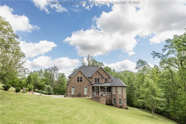 2804 Hash Ridge Rd, Barboursville, WV 25504 - back of property with a yard and brick siding