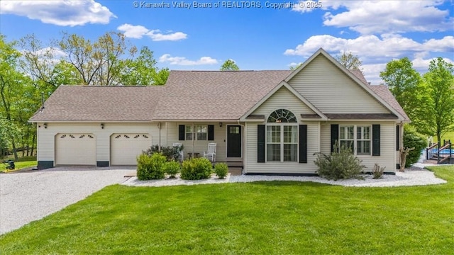 ranch-style house with roof with shingles, driveway, a front yard, and a garage