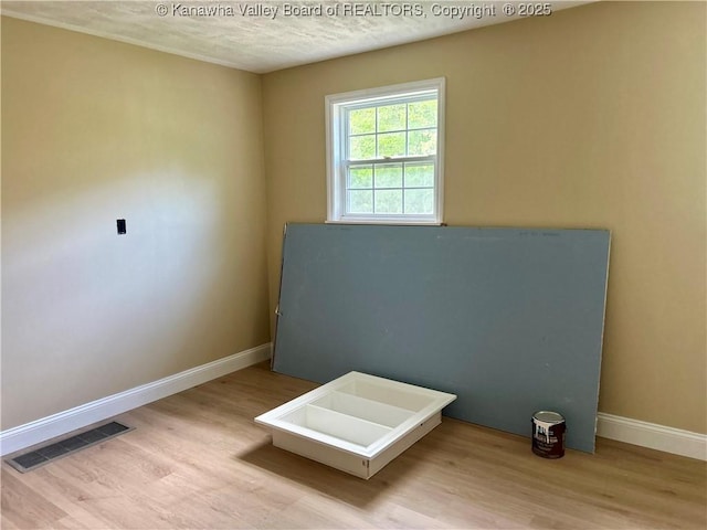 405 Crestview Dr, Charleston, WV 25302 - misc room with baseboards, a textured ceiling, wood finished floors, and visible vents