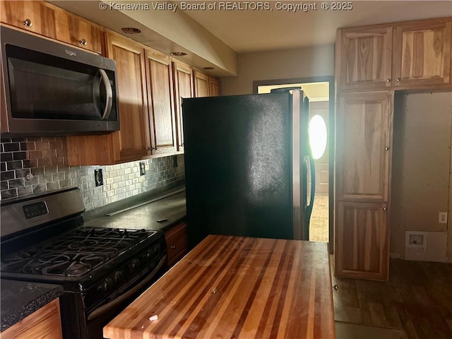 405 Crestview Dr, Charleston, WV 25302 - kitchen with tasteful backsplash, stainless steel microwave, freestanding refrigerator, butcher block counters, and range with gas stovetop