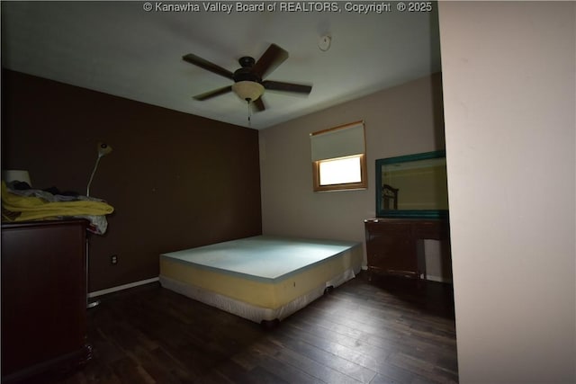 bedroom with baseboards, ceiling fan, and hardwood / wood-style floors