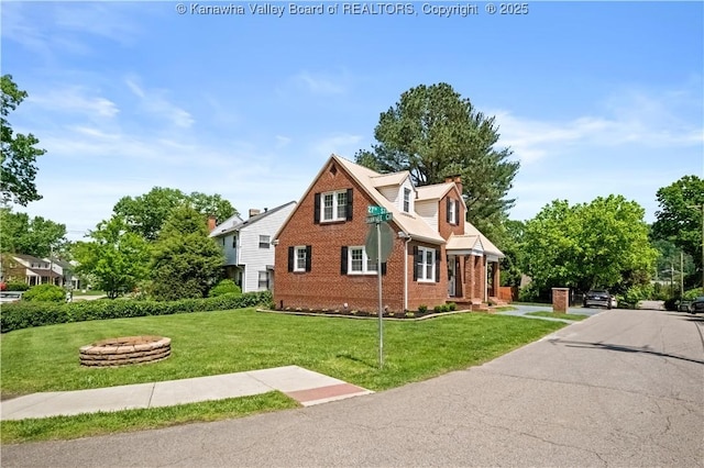 315 27th St SE, Charleston, WV 25304 - view of home's exterior featuring a yard and brick siding