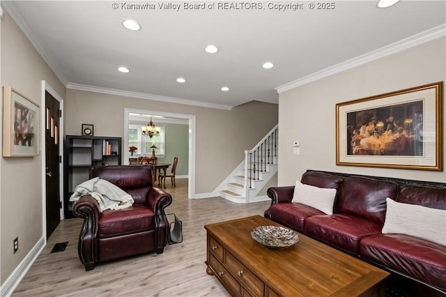 315 27th St SE, Charleston, WV 25304 - living area featuring stairway, a chandelier, light wood-style flooring, and crown molding