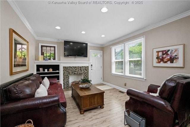 315 27th St SE, Charleston, WV 25304 - living area with crown molding, baseboards, light wood-type flooring, and recessed lighting