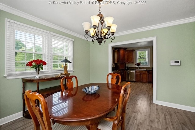 315 27th St SE, Charleston, WV 25304 - dining room featuring plenty of natural light, a chandelier, baseboards, and ornamental molding