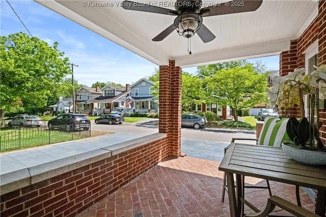 315 27th St SE, Charleston, WV 25304 - view of patio / terrace featuring covered porch, fence, a residential view, and ceiling fan