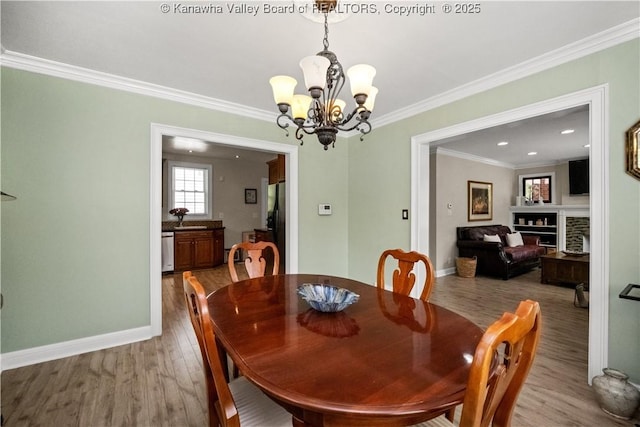 315 27th St SE, Charleston, WV 25304 - dining space with crown molding, wood finished floors, and baseboards