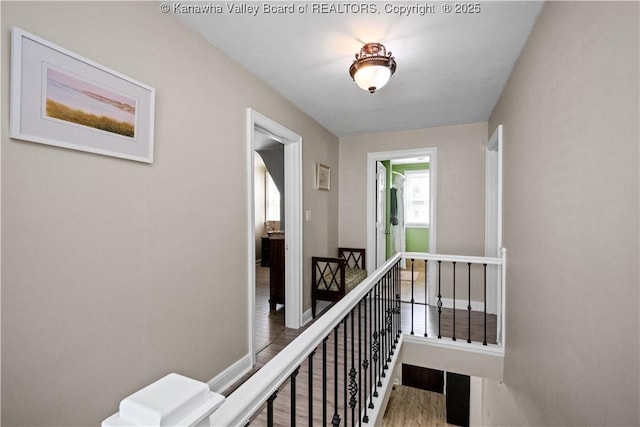315 27th St SE, Charleston, WV 25304 - hall featuring wood finished floors, an upstairs landing, and baseboards