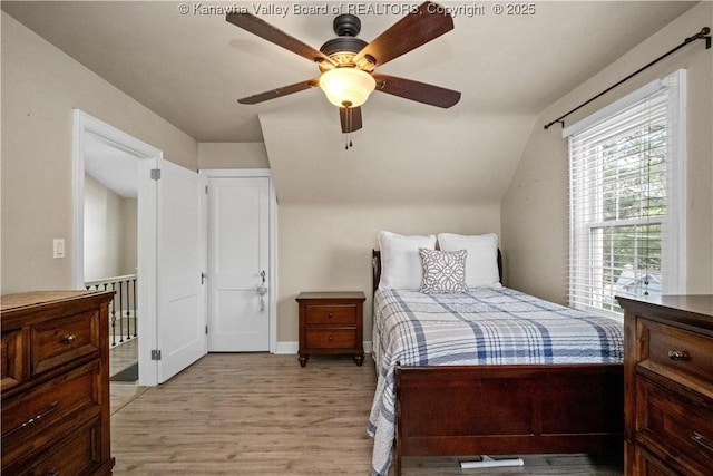 315 27th St SE, Charleston, WV 25304 - bedroom featuring a ceiling fan, light wood-style flooring, and vaulted ceiling