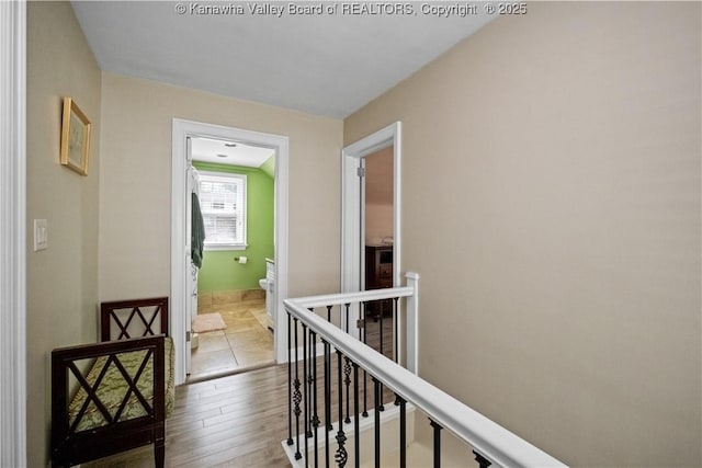 315 27th St SE, Charleston, WV 25304 - hall with baseboards, an upstairs landing, and wood finished floors