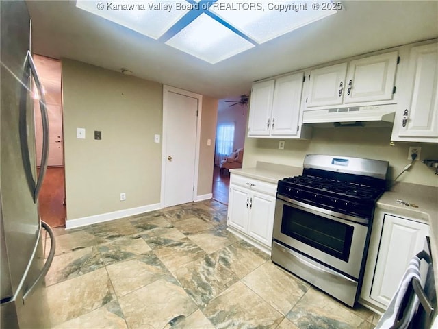 kitchen with under cabinet range hood, light countertops, white cabinetry, and stainless steel appliances