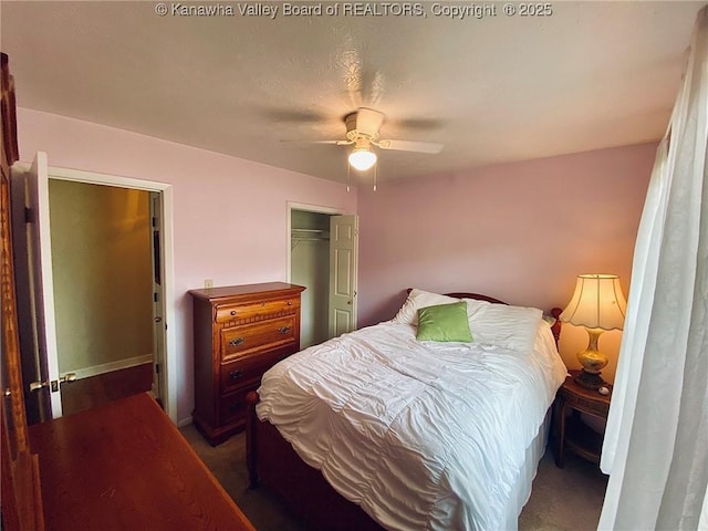 bedroom with ceiling fan and a closet