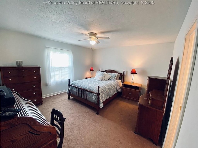 bedroom featuring carpet floors, a ceiling fan, and baseboards