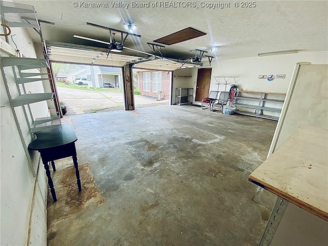 garage featuring a garage door opener