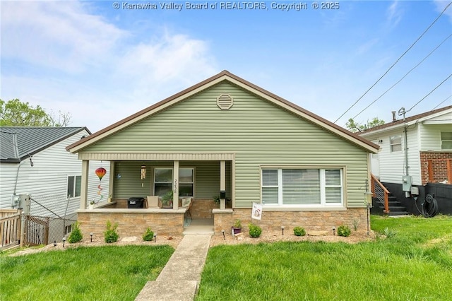 2258 Curtis Ave, Saint Albans, WV 25177 - bungalow with fence, stone siding, and a front yard