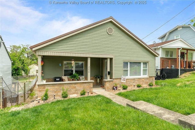 2258 Curtis Ave, Saint Albans, WV 25177 - view of front of home featuring covered porch, a front lawn, and fence