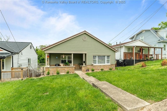 2258 Curtis Ave, Saint Albans, WV 25177 - bungalow-style home with stone siding and a front yard