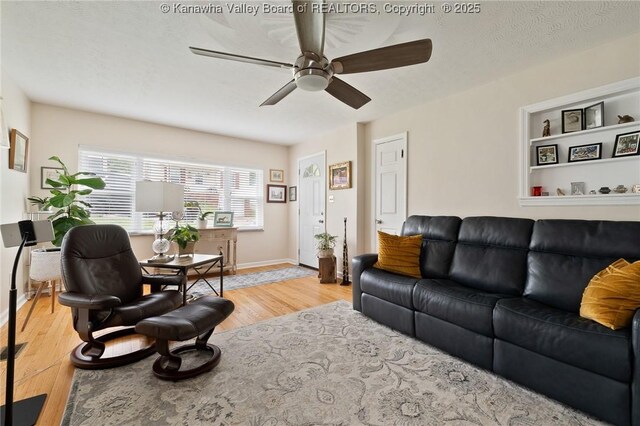 2258 Curtis Ave, Saint Albans, WV 25177 - living area featuring light wood finished floors, baseboards, and ceiling fan