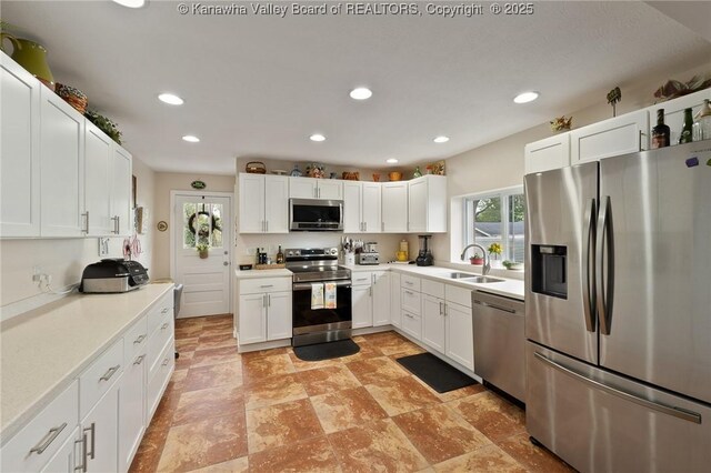 2258 Curtis Ave, Saint Albans, WV 25177 - kitchen featuring recessed lighting, white cabinets, appliances with stainless steel finishes, and a sink