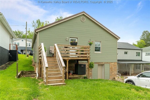 2258 Curtis Ave, Saint Albans, WV 25177 - rear view of house with a yard, stairs, a wooden deck, and central AC