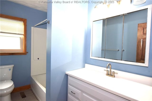 full bathroom featuring toilet, tile patterned floors, vanity, and shower / bathing tub combination
