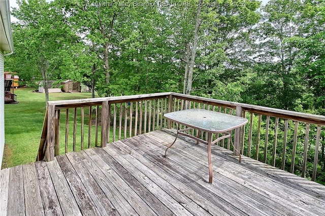 433 Kingswood Dr, Culloden, WV 25510 - deck featuring a lawn, an outbuilding, and a storage shed