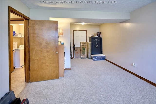 433 Kingswood Dr, Culloden, WV 25510 - unfurnished room with carpet flooring, a textured ceiling, washer and dryer, and baseboards