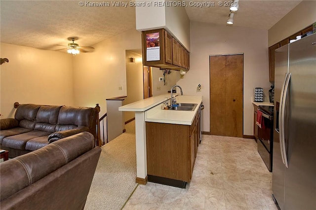 433 Kingswood Dr, Culloden, WV 25510 - kitchen with a sink, ceiling fan, open floor plan, light countertops, and appliances with stainless steel finishes