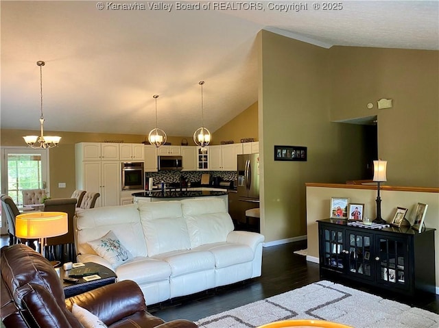 living room with baseboards, dark wood finished floors, an inviting chandelier, and vaulted ceiling