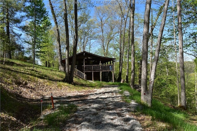 view of outdoor structure featuring a forest view