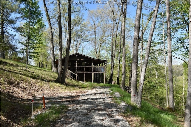 view of outdoor structure featuring a forest view