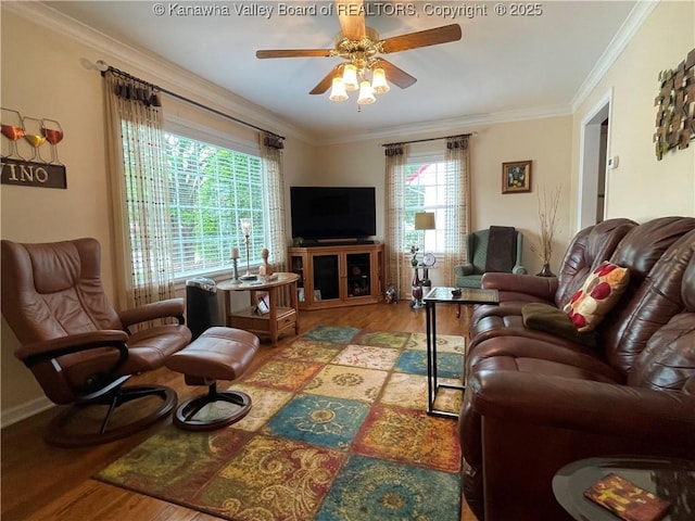 living area featuring crown molding, wood finished floors, and ceiling fan
