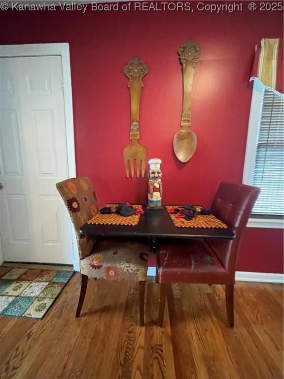 dining room with wood finished floors and baseboards