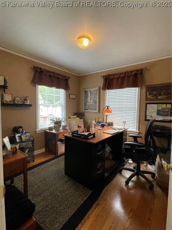 home office featuring crown molding and wood finished floors
