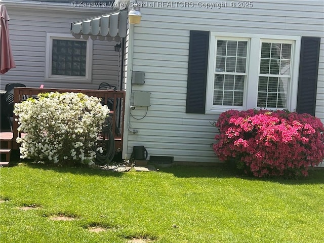 view of home's exterior with a lawn