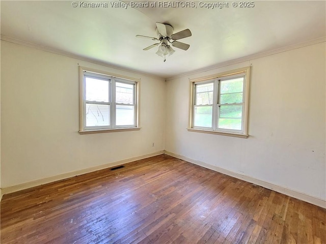 728 98th St, Charleston, WV 25315 - spare room with crown molding, wood-type flooring, baseboards, and plenty of natural light