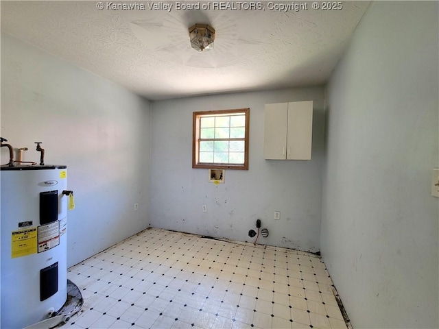 728 98th St, Charleston, WV 25315 - interior space featuring electric water heater, laundry area, light floors, and a textured ceiling