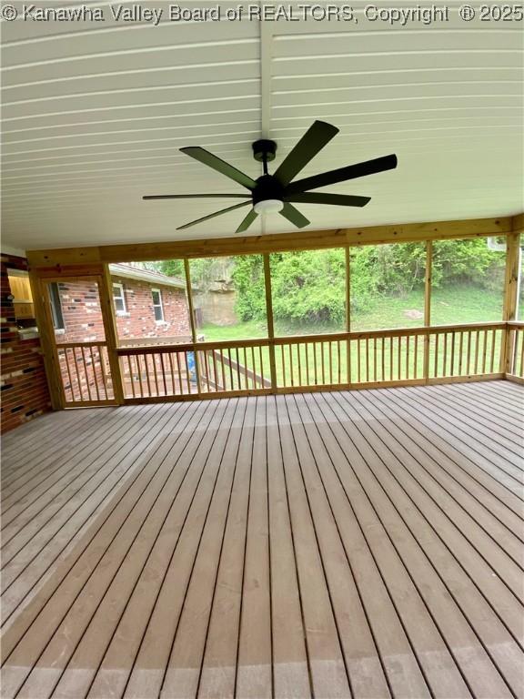 wooden terrace with a ceiling fan