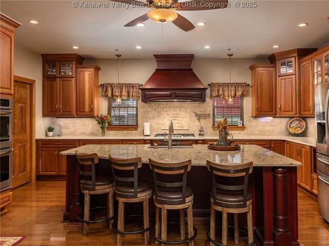 2648 Bedford Chapel, Milton, WV 25541 - kitchen with premium range hood, ceiling fan, backsplash, recessed lighting, and glass insert cabinets