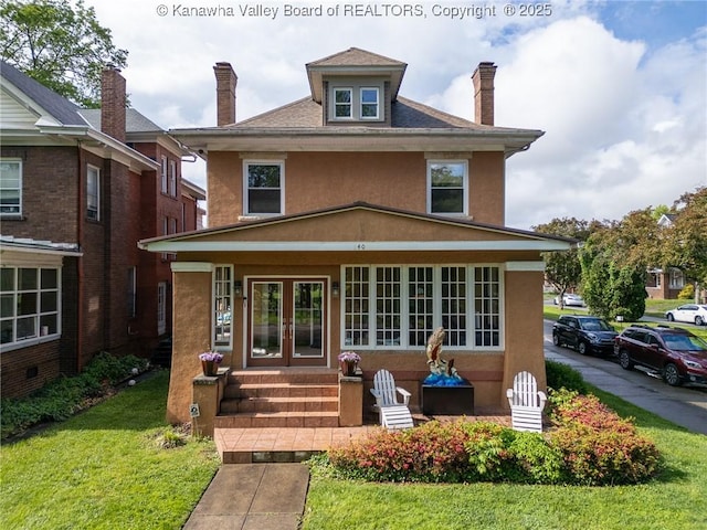 840 13th Ave, Huntington, WV 25701 - traditional style home with stucco siding, french doors, a chimney, a front yard, and entry steps