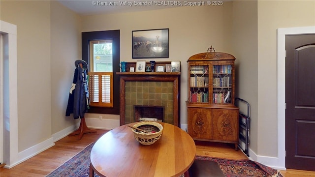 840 13th Ave, Huntington, WV 25701 - living area with wood finished floors, baseboards, and a fireplace